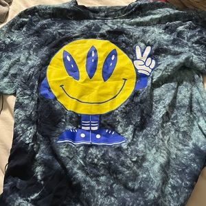 Tie dye shirt with graphic image.